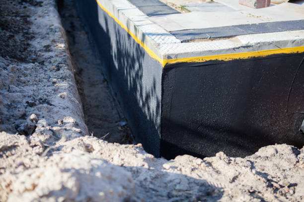 Professional Waterproofing technician working in Vienna, GA